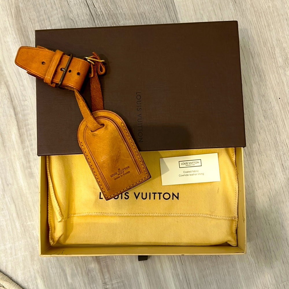 Louis Vuitton Luggage Tag and Poignet. Not included are box and dust bag.